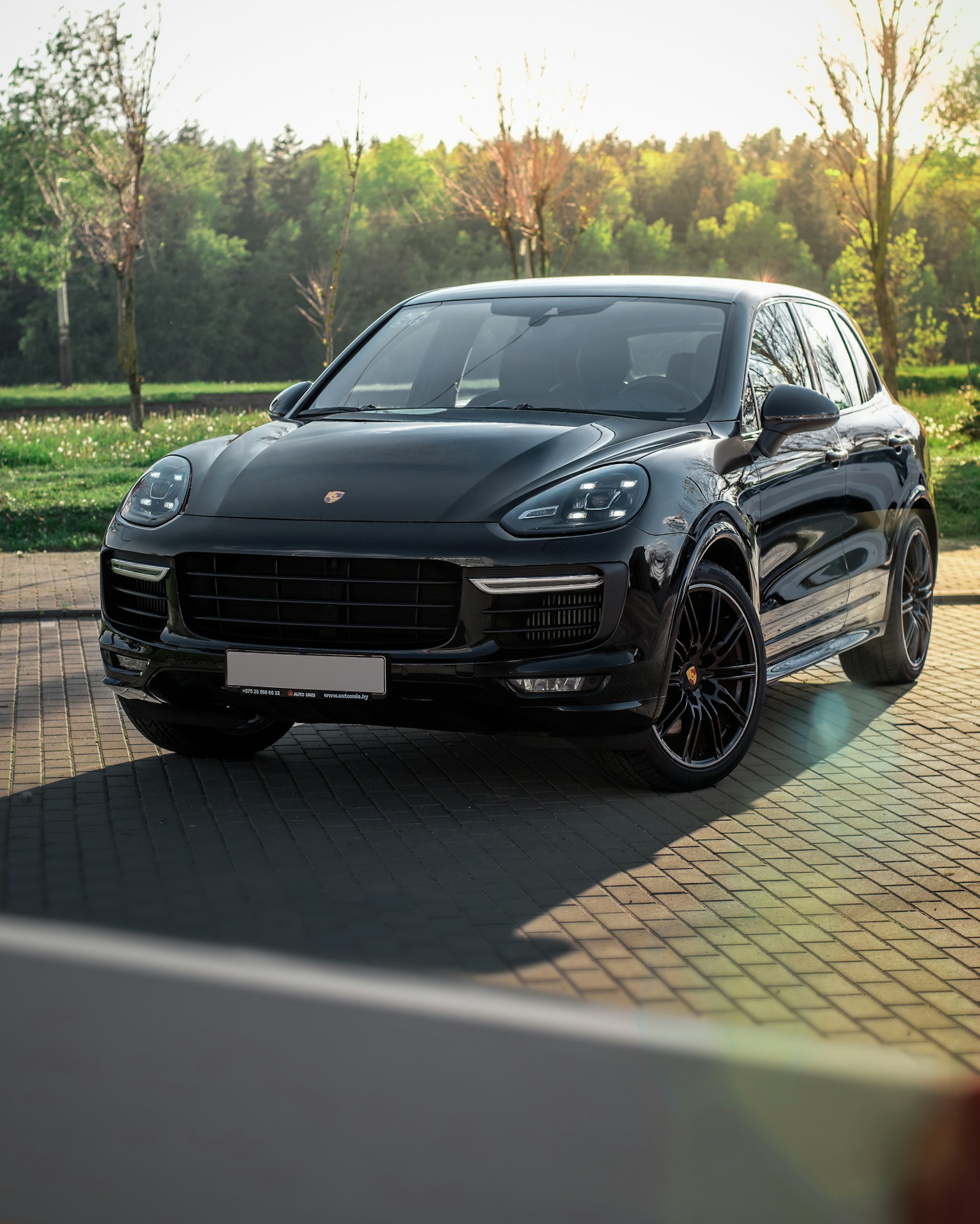 A luxury vehicle arrives for a private psilocybin ceremony