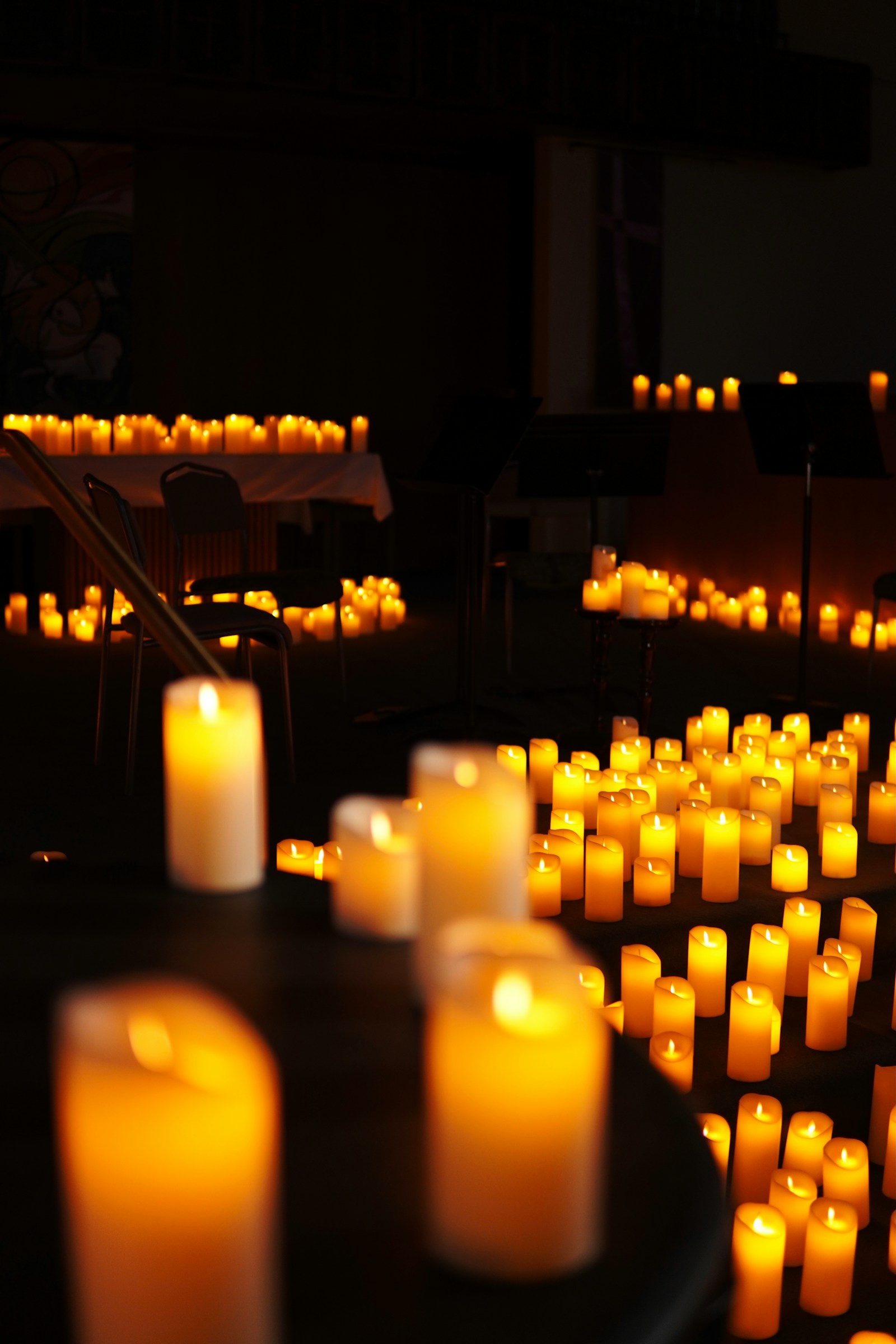 Intimate candlelit ceremonial room where the mushroom is ingested