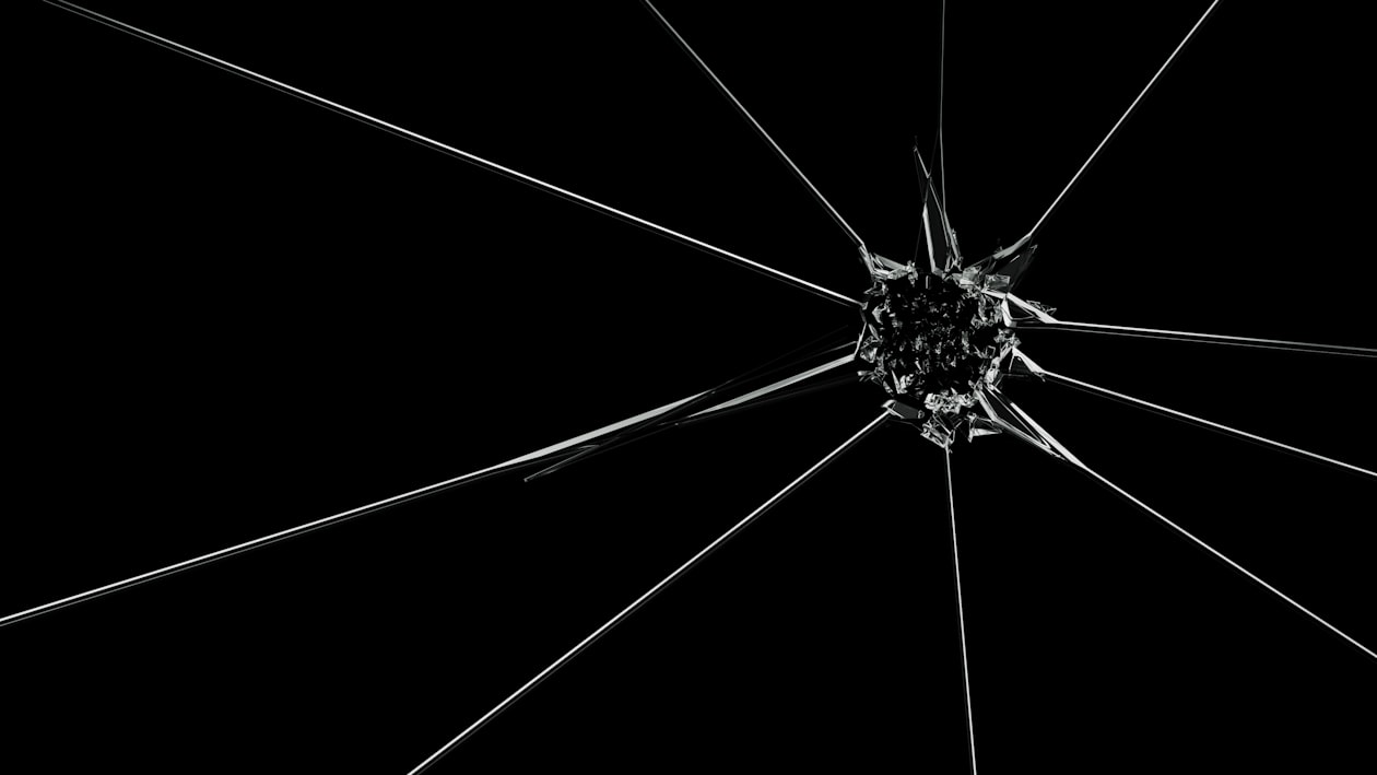 Shattered glass with radial cracks representing the fragility of an unstable nervous system