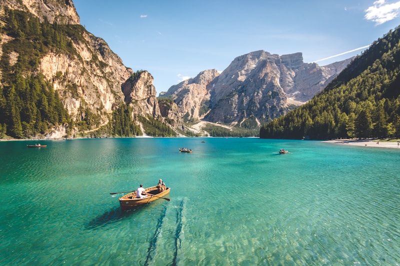 Peaceful lakeside landscape with snow-capped mountains